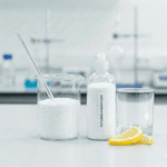 White automatic dishwasher powder bottle with formulationmarket label on a lab table.